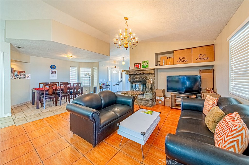9922 Phelan Road Oak Hills, CA 92344 - Photo 2 of 30 a living room with furniture fireplace and flat screen tv