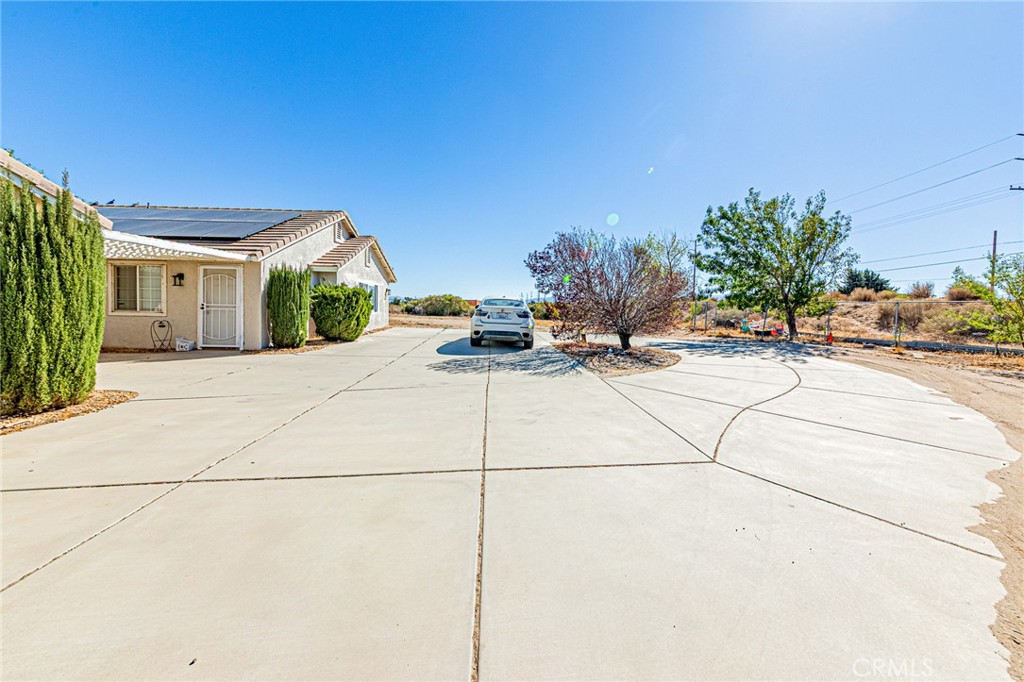 9922 Phelan Road Oak Hills, CA 92344 - Photo 21 of 30 a view of a house with a patio