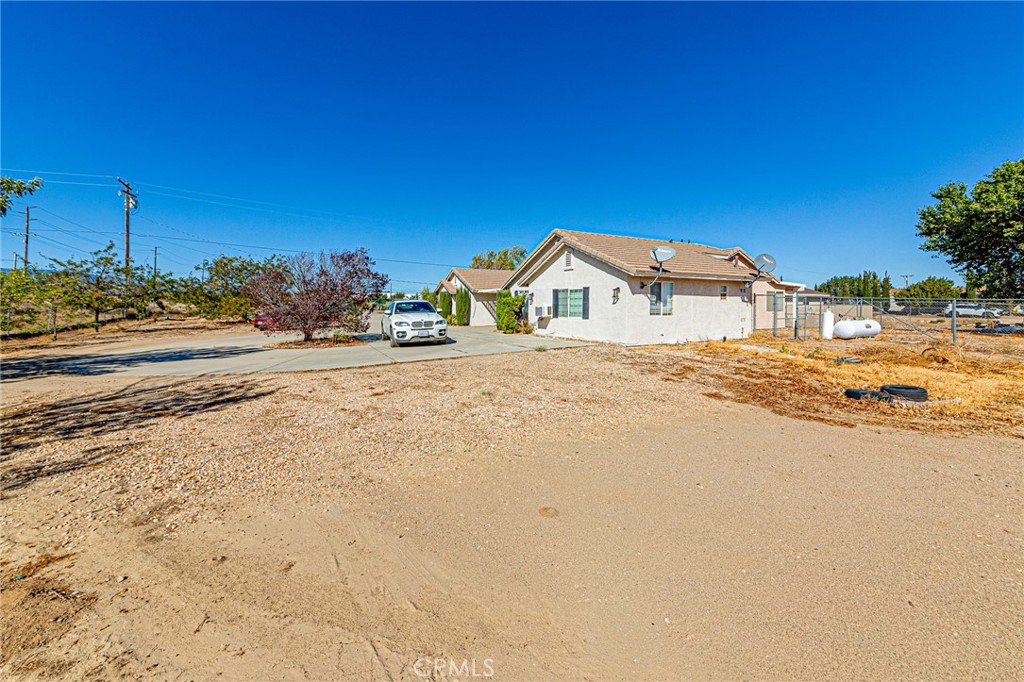 9922 Phelan Road Oak Hills, CA 92344 - Photo 24 of 30 a front view of a house with a yard