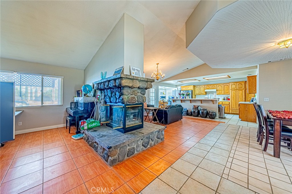 9922 Phelan Road Oak Hills, CA 92344 - Photo 4 of 30 a living room filled with furniture and dining table