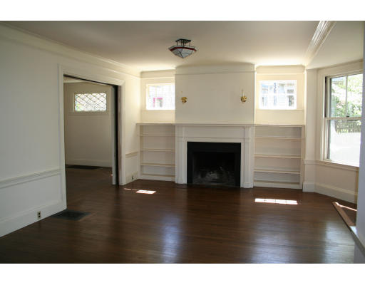 125 Middlesex Road Brookline, MA 02467 - Photo 5 of 8 a view of a livingroom with wooden floor and a fireplace