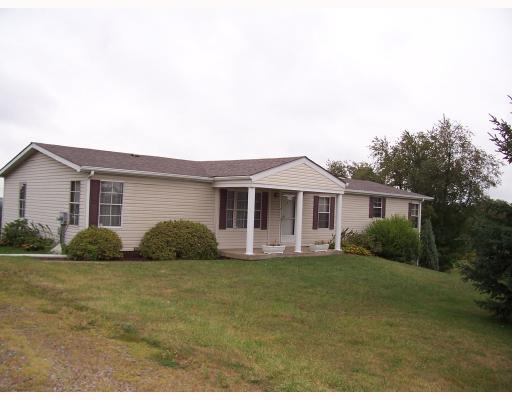 Exterior Front. Larger than it looks!  Two driveways,