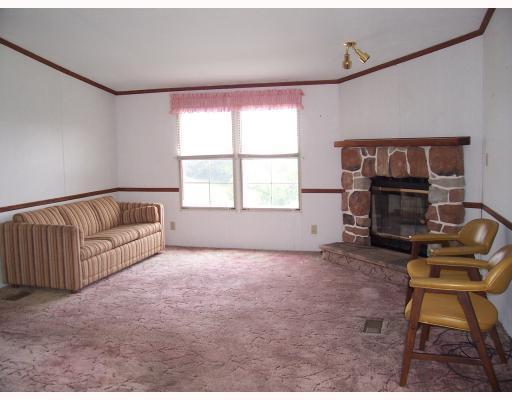 Den/Family/Great Room. 1st floor family room with corner stone fireplace and views of the valley!