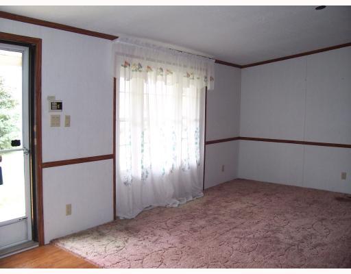 Living Room. Spacious living room with front entry, opens to dining area and two bedrooms and full bath