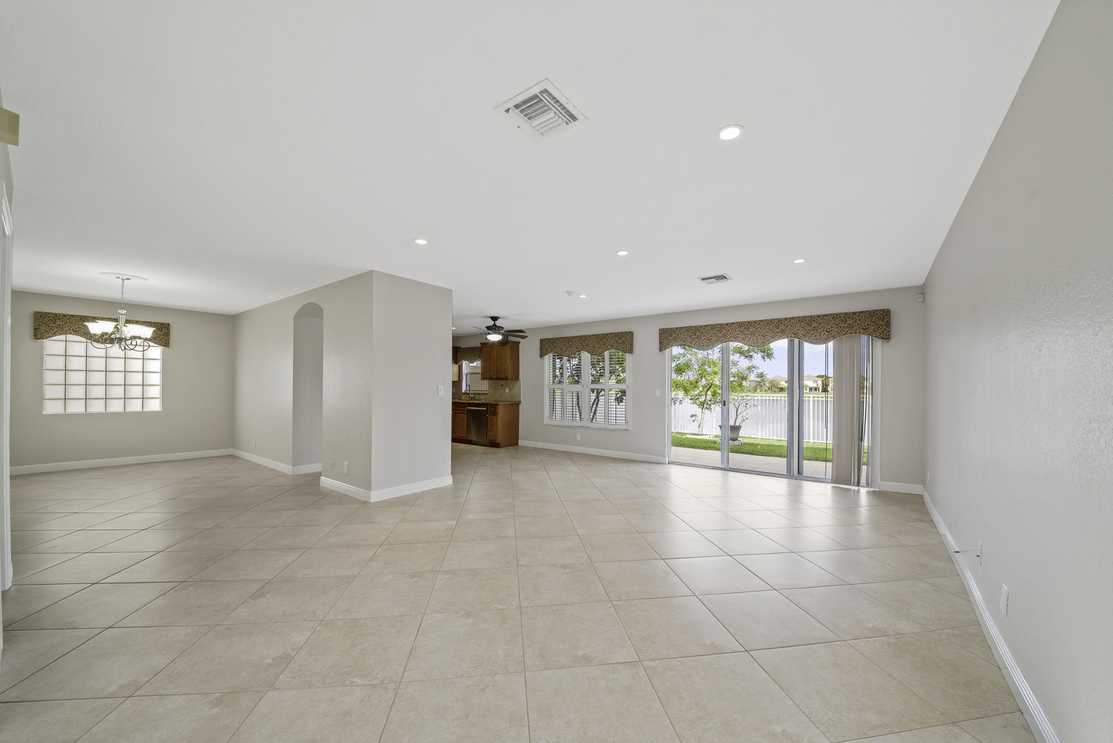 6237 Adriatic Way Greenacres, FL 33413 - Photo 16 of 33 LIVING ROOM DINING ROOM