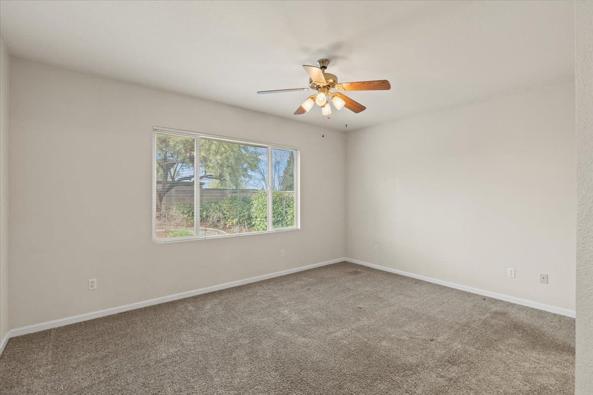 596 Geary Lane Lincoln, CA 95648 - Photo 13 of 27 an empty room with windows and fan