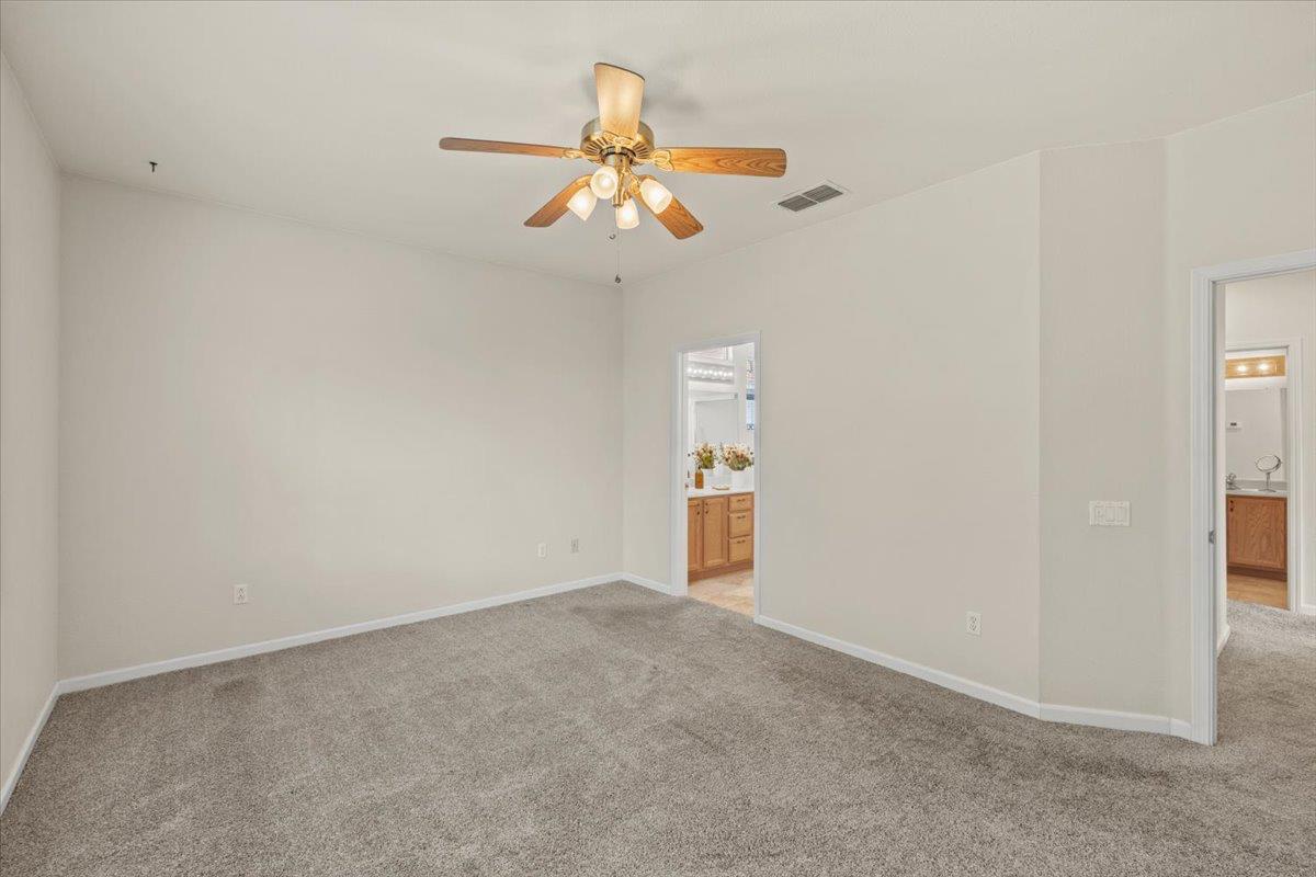596 Geary Lane Lincoln, CA 95648 - Photo 14 of 27 an empty room with windows and fan