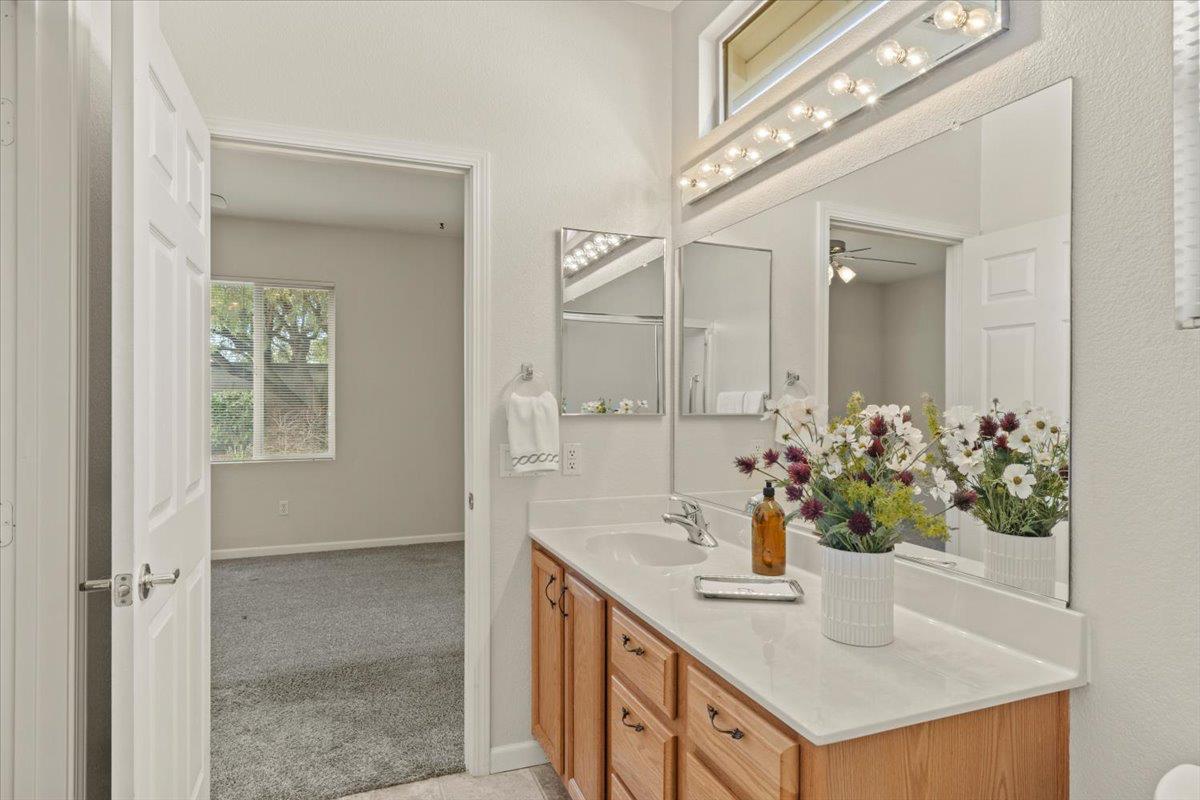 596 Geary Lane Lincoln, CA 95648 - Photo 17 of 27 a bathroom with a sink and a mirror