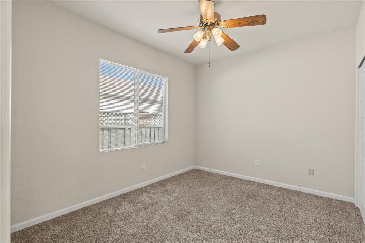 596 Geary Lane Lincoln, CA 95648 - Photo 18 of 27 an empty room with a window and a fan
