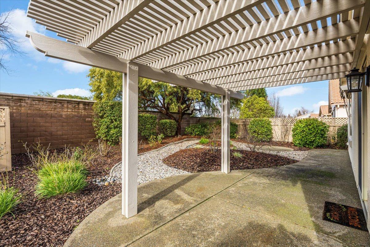 596 Geary Lane Lincoln, CA 95648 - Photo 23 of 27 a view of a patio with table and chairs potted plants