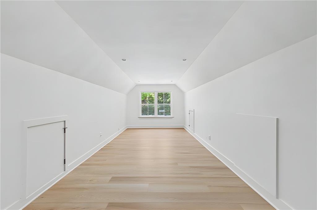 376 Hunnicut Road Southeast Mableton, GA 30126 - Photo 68 of 73 a view of an empty room with wooden floor and a window