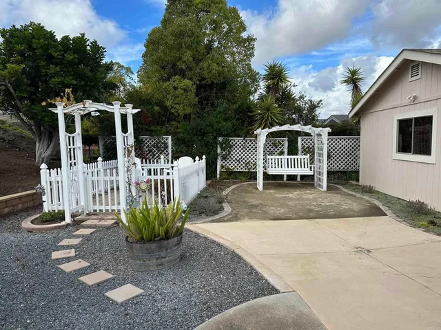 a front view of a house with a yard garage