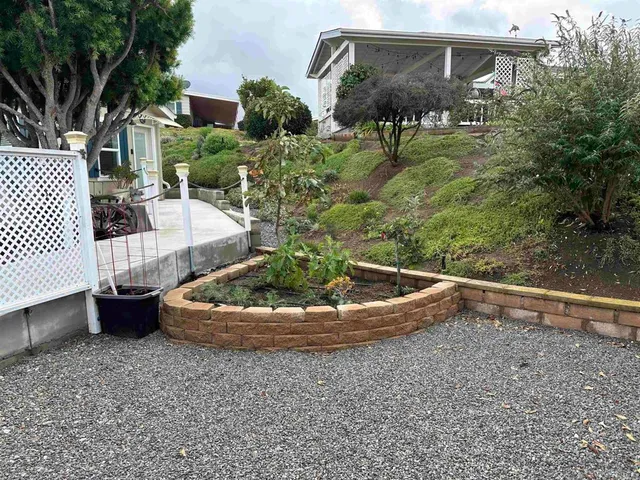 a backyard of a house with outdoor seating