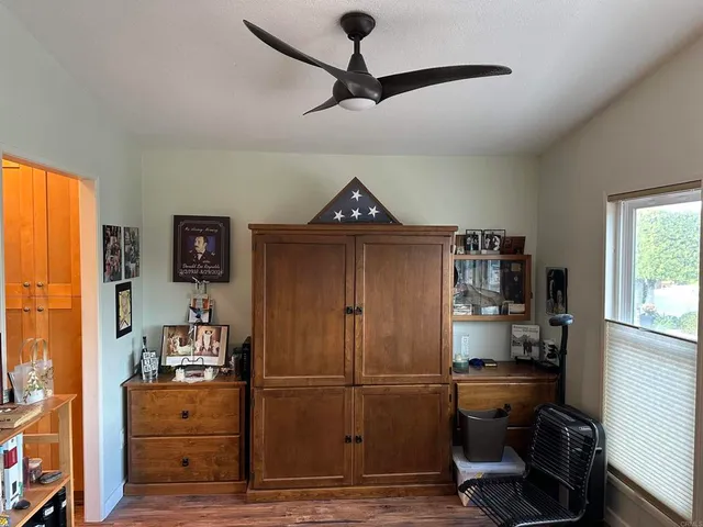 a kitchen with refrigerator and window