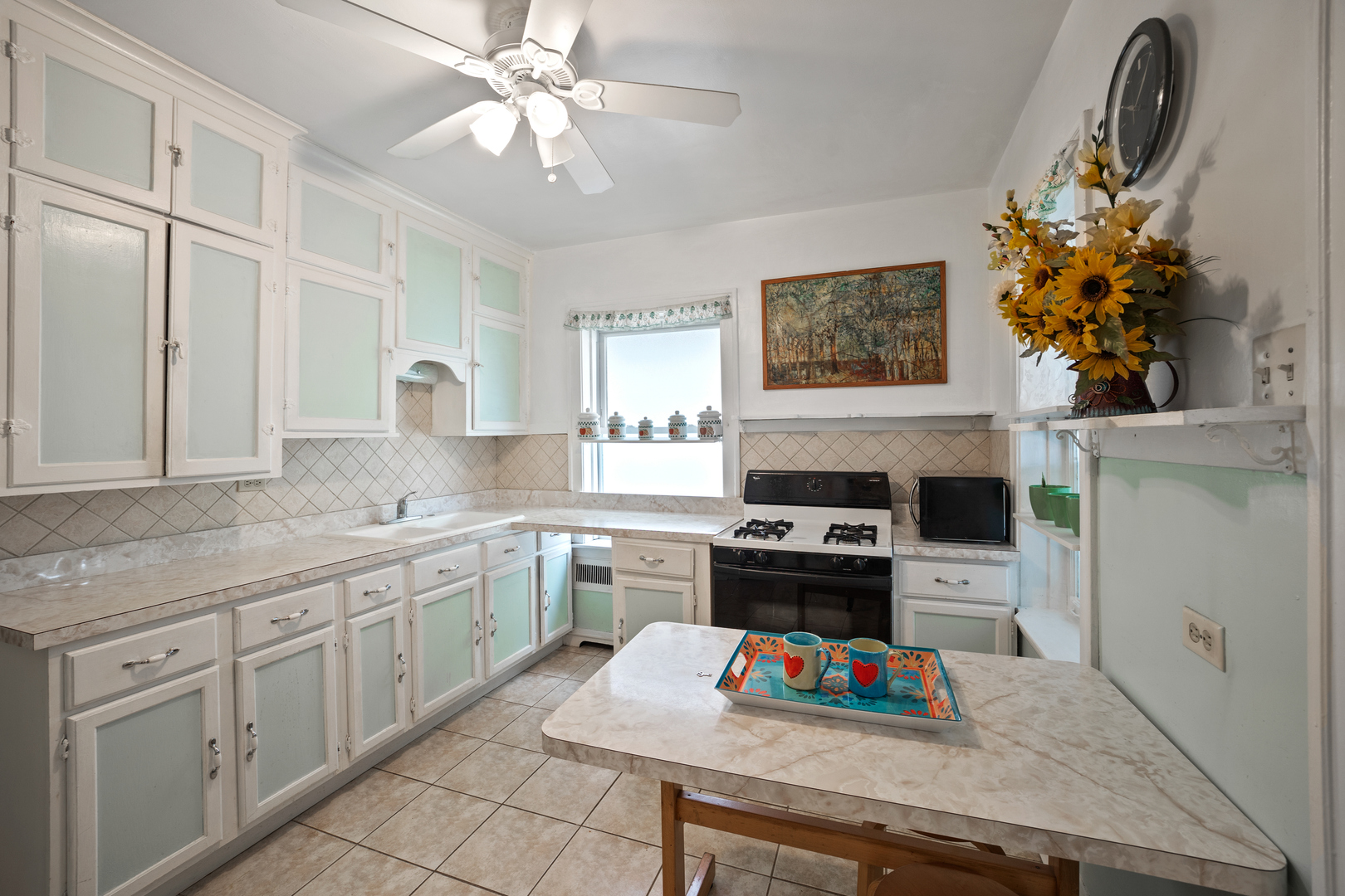5124 West Nelson Street Chicago, IL 60641 - Photo 11 of 21 a kitchen with appliances cabinets and a counter top space