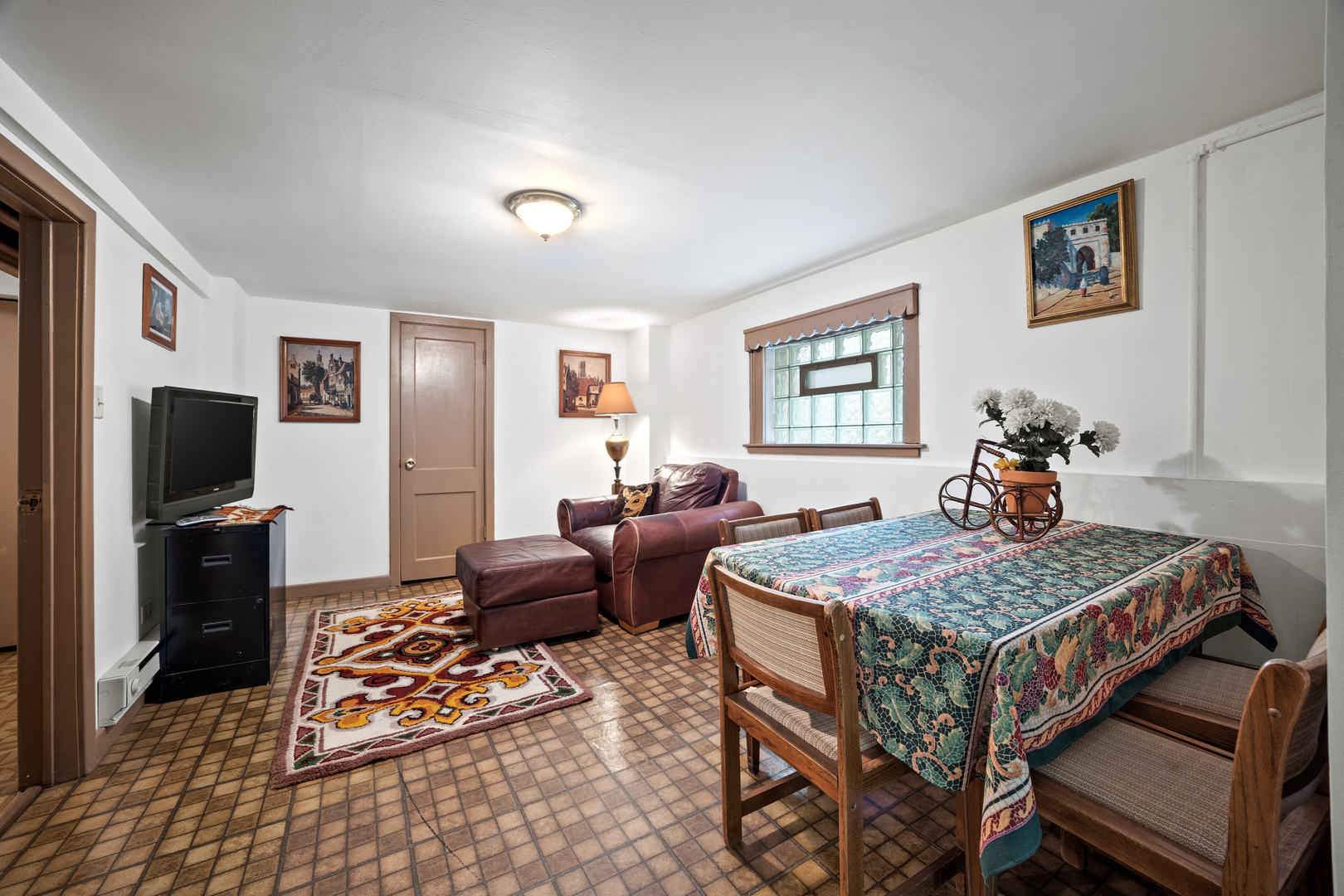5124 West Nelson Street Chicago, IL 60641 - Photo 14 of 21 a living room with furniture and a flat screen tv