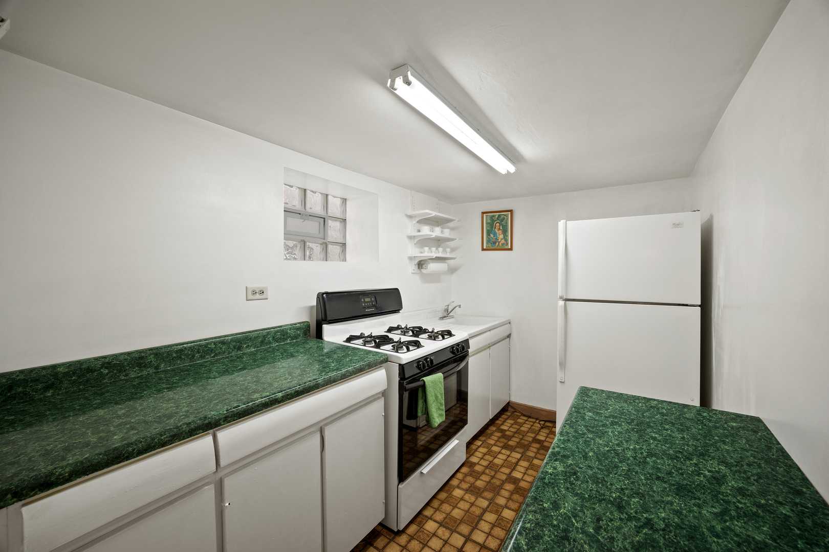 5124 West Nelson Street Chicago, IL 60641 - Photo 17 of 21 a kitchen with a stove and a refrigerator