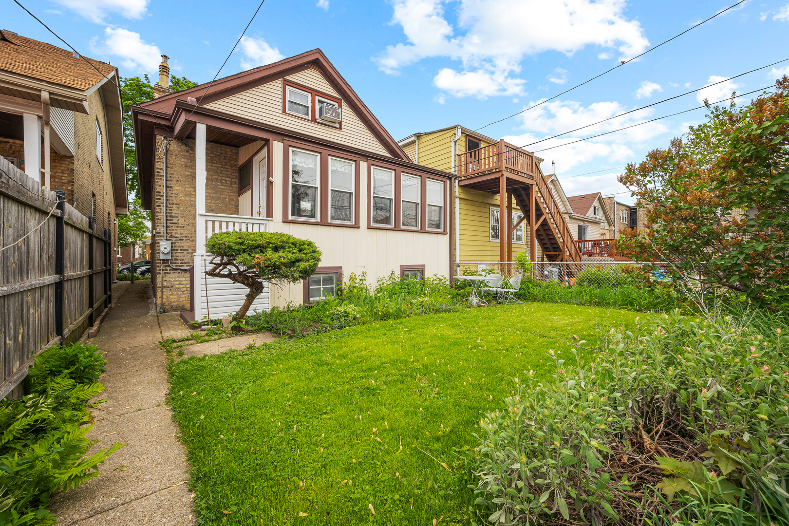 5124 West Nelson Street Chicago, IL 60641 - Photo 20 of 21 a view of a house with backyard and garden