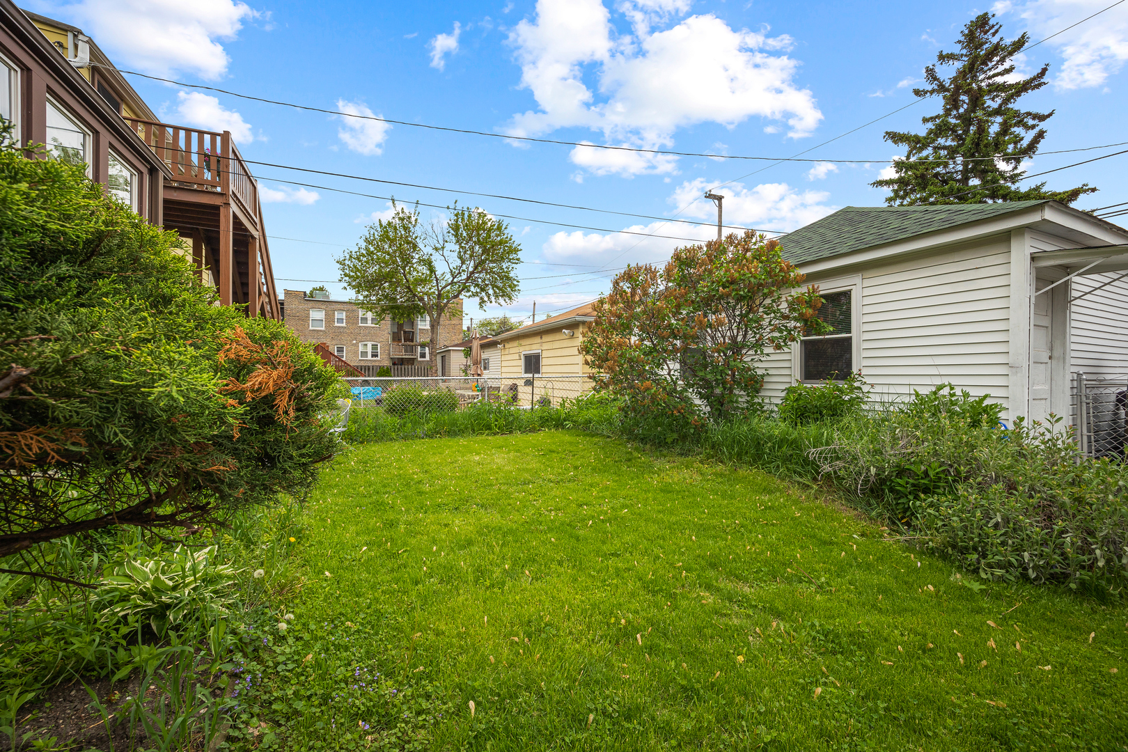5124 West Nelson Street Chicago, IL 60641 - Photo 21 of 21 a house view with a garden space