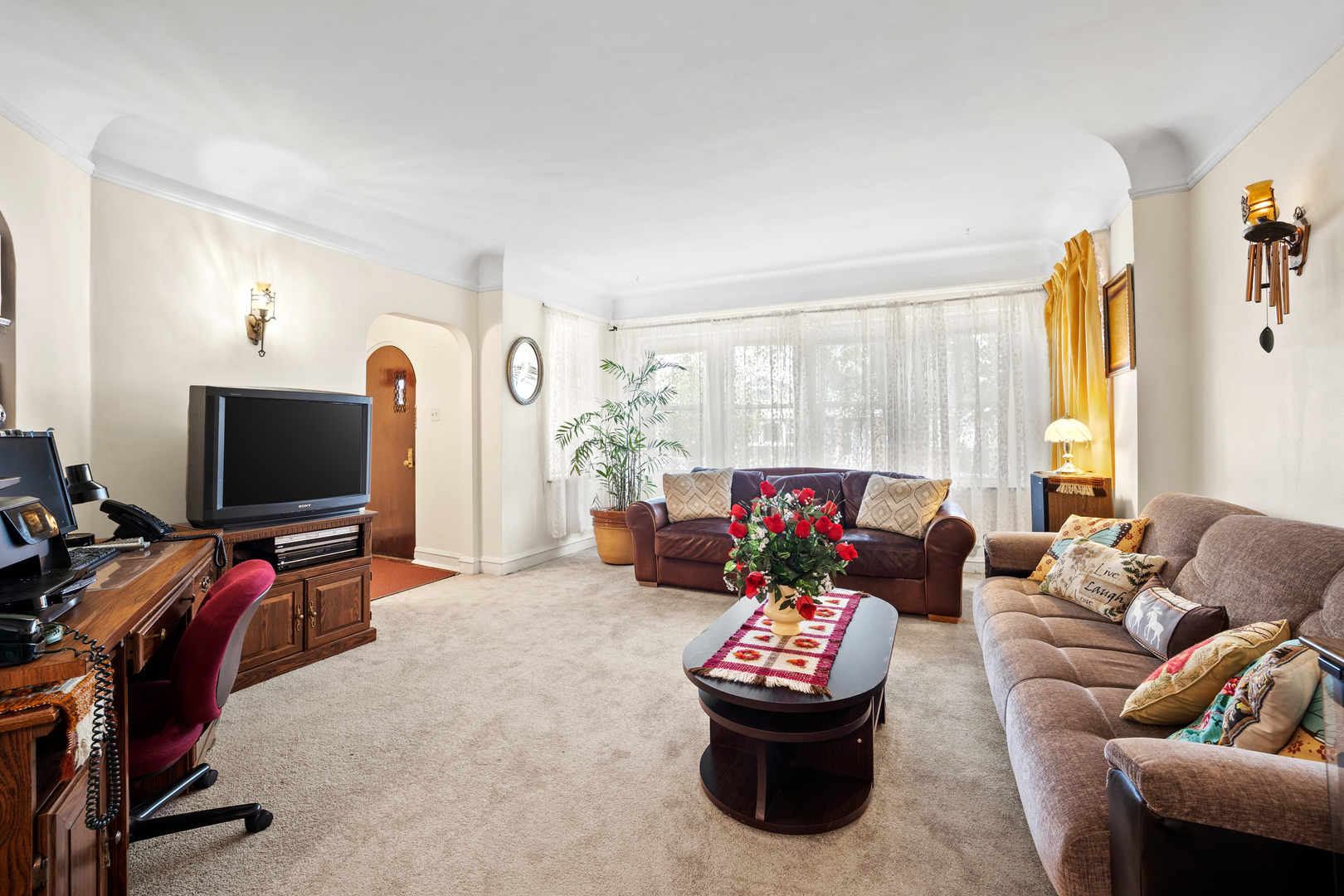 5124 West Nelson Street Chicago, IL 60641 - Photo 4 of 21 a living room with furniture and a flat screen tv