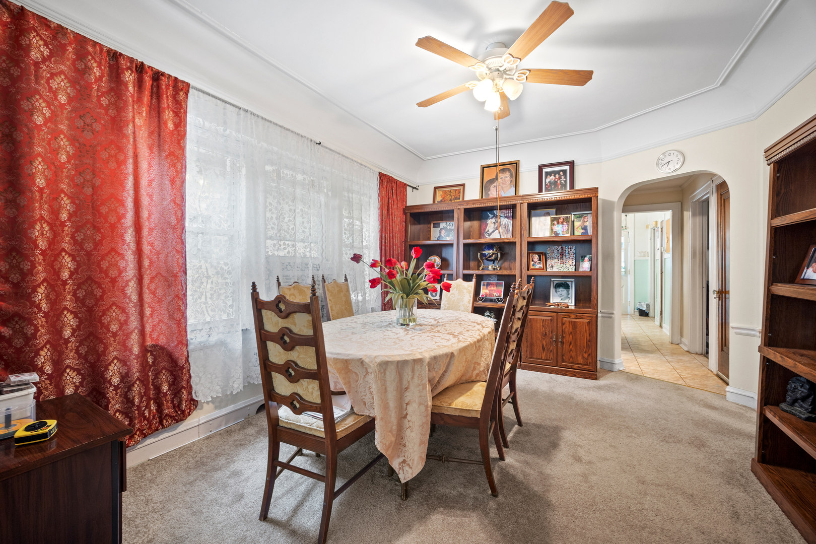 5124 West Nelson Street Chicago, IL 60641 - Photo 5 of 21 a view of a dining room with furniture and a chandelier fan