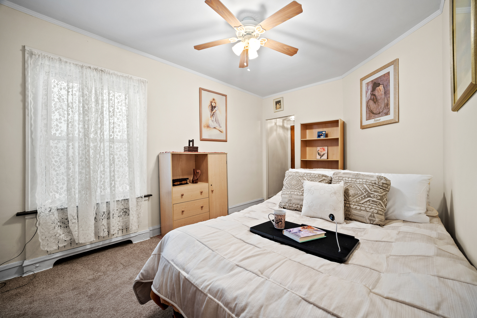 5124 West Nelson Street Chicago, IL 60641 - Photo 7 of 21 a bedroom with a bed and a chandelier