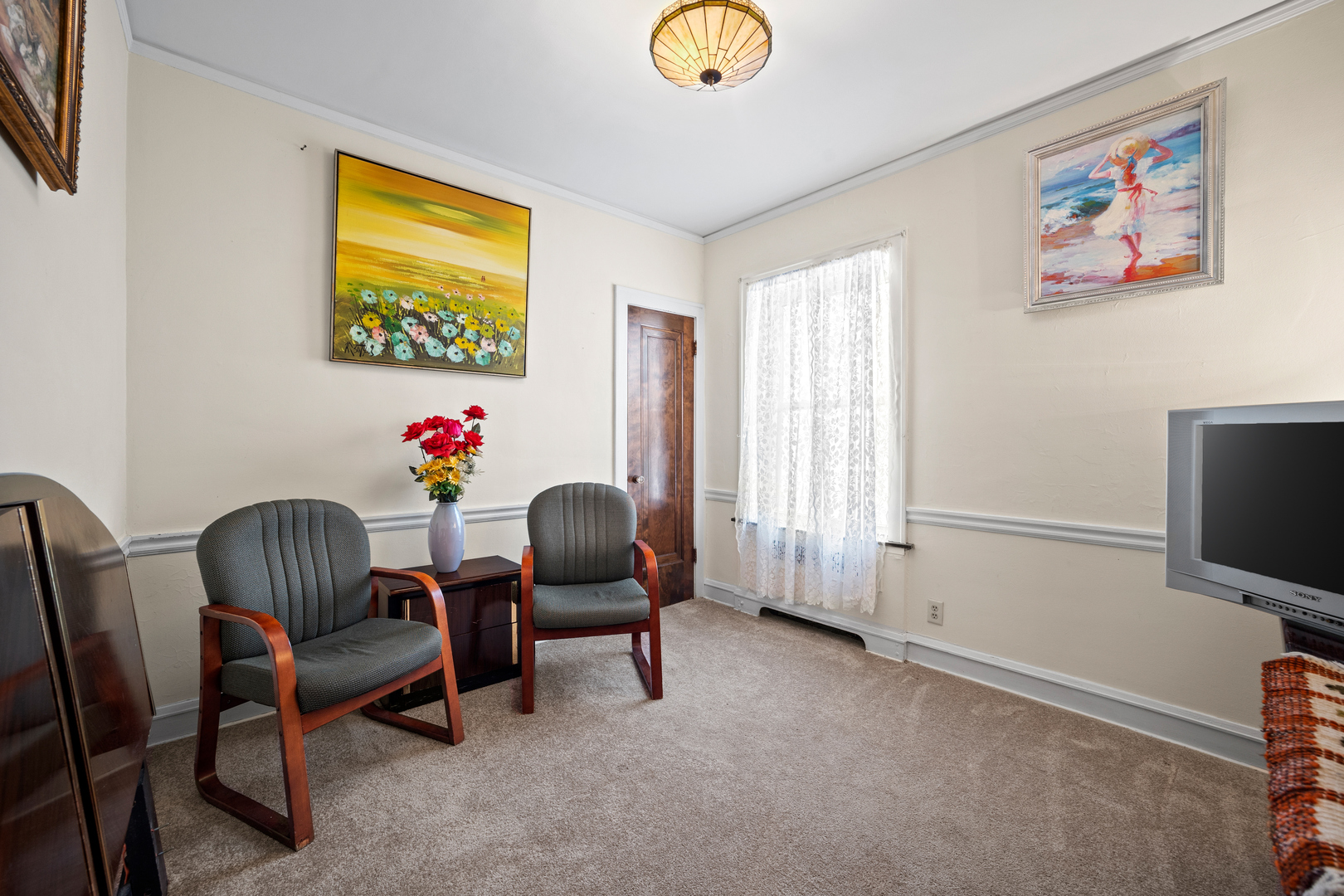 5124 West Nelson Street Chicago, IL 60641 - Photo 9 of 21 a living room with furniture and a flat screen tv