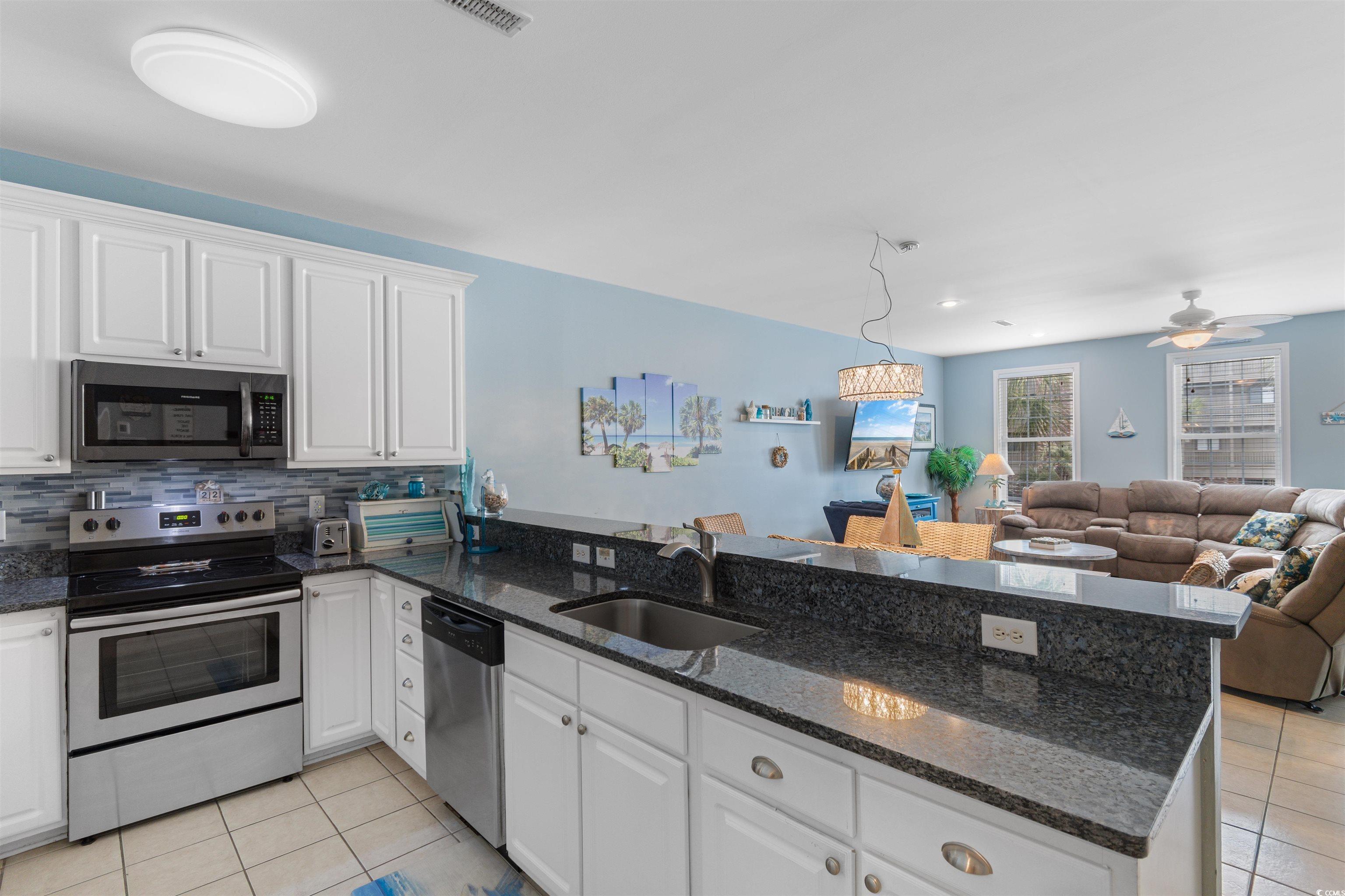 808 North Ocean Boulevard Surfside Beach, SC 29575 - Photo 38 of 39 Kitchen with open floor plan, a peninsula, and app