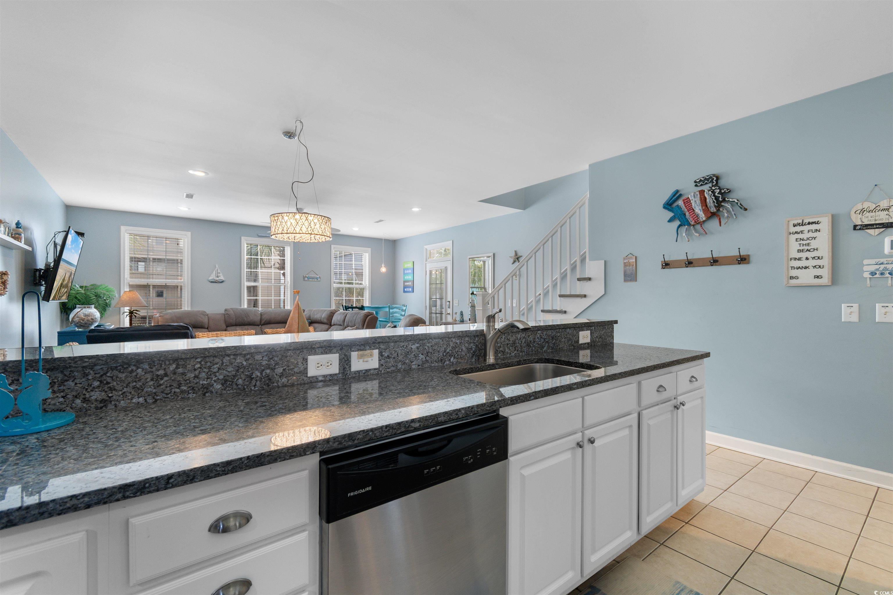 808 North Ocean Boulevard Surfside Beach, SC 29575 - Photo 14 of 39 Kitchen featuring white cabinetry, stainless steel