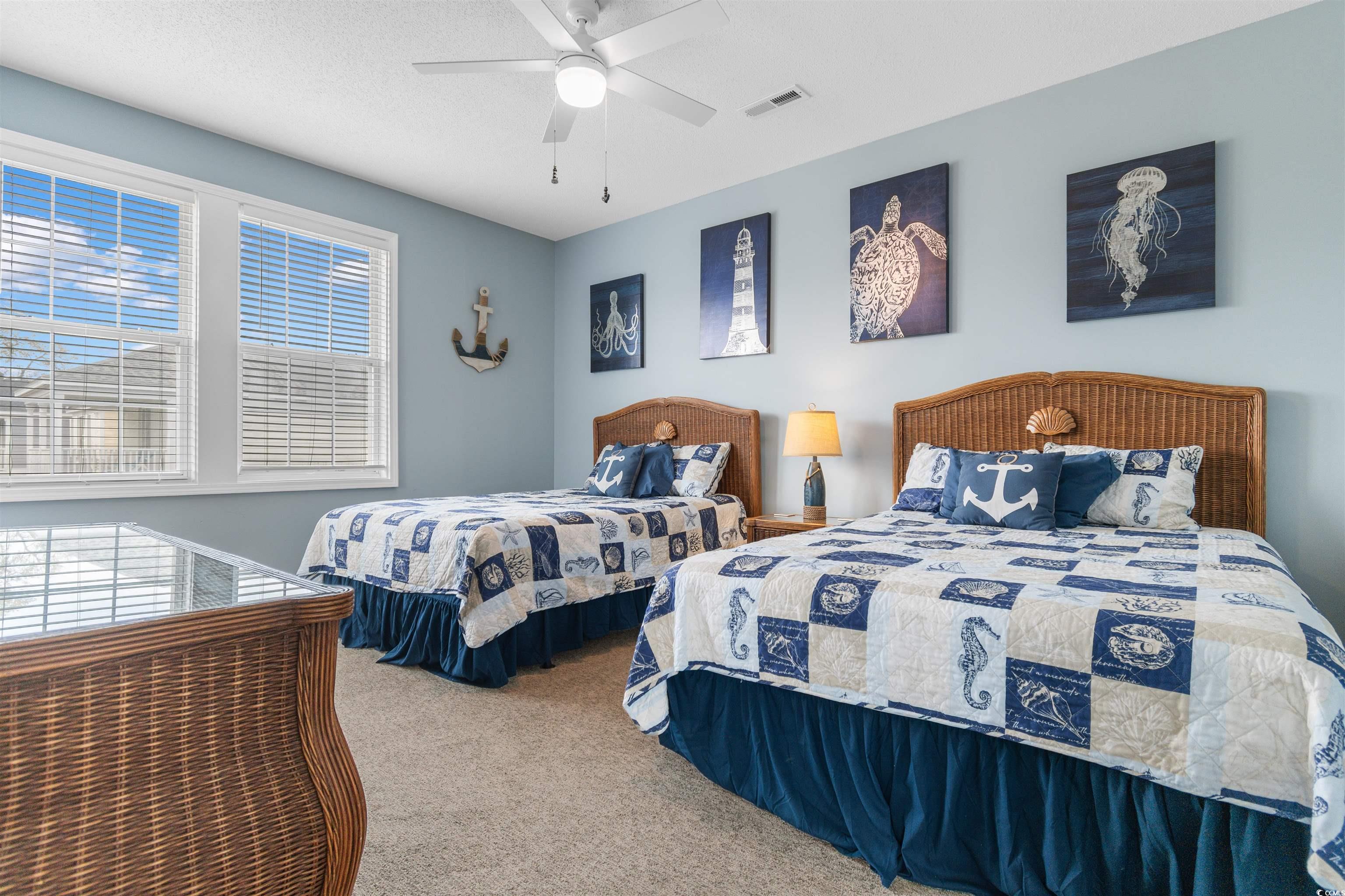 808 North Ocean Boulevard Surfside Beach, SC 29575 - Photo 21 of 39 Large guest bedroom with ceiling fan