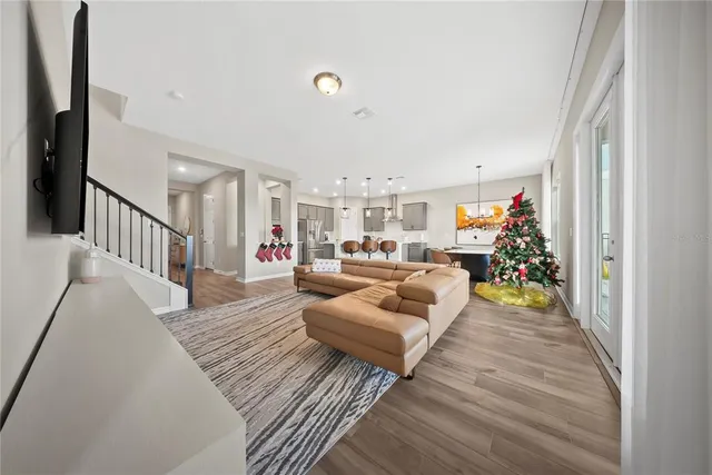 a large kitchen with a table and chairs