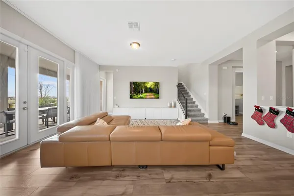 a workspace with furniture window and wooden floor