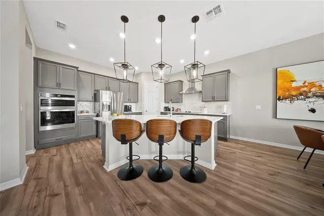 wooden floor with a bathroom