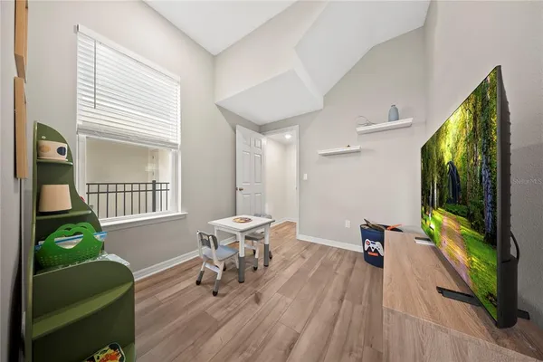 a bedroom with a bed and a couch