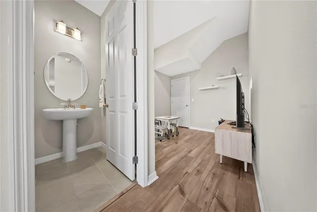 a view of a balcony next to a yard