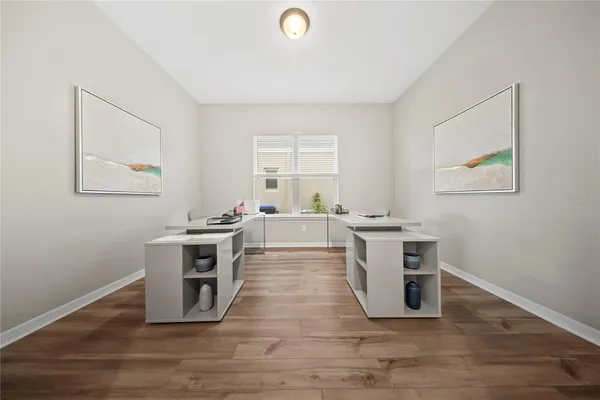 a spacious bedroom with a bed and a couch