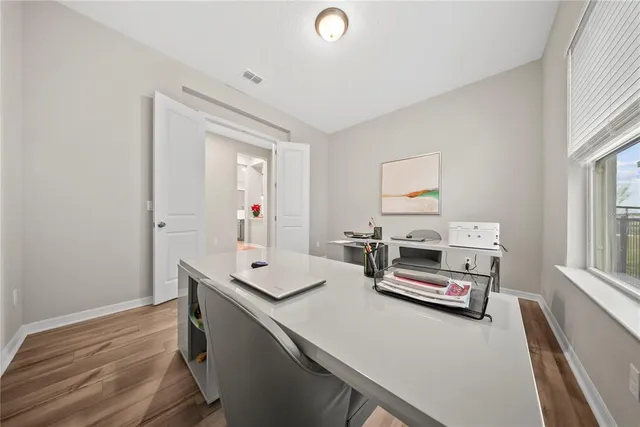 a bathroom with a double vanity sink mirror and bathtub