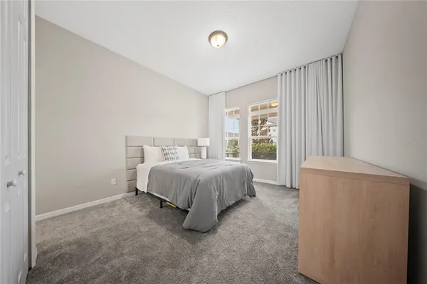 a spacious bathroom with a bathtub shower and sink