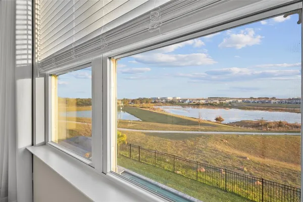 a bedroom with a bed and cabinets