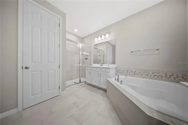 a view of a patio with table and chairs