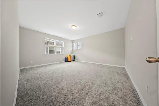 a view of a livingroom with furniture and window