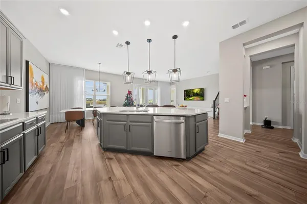 a kitchen with stainless steel appliances granite countertop lots of counter top space and cabinets