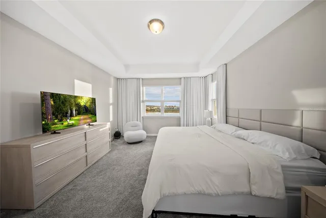 a view of a kitchen with furniture and floor to ceiling window
