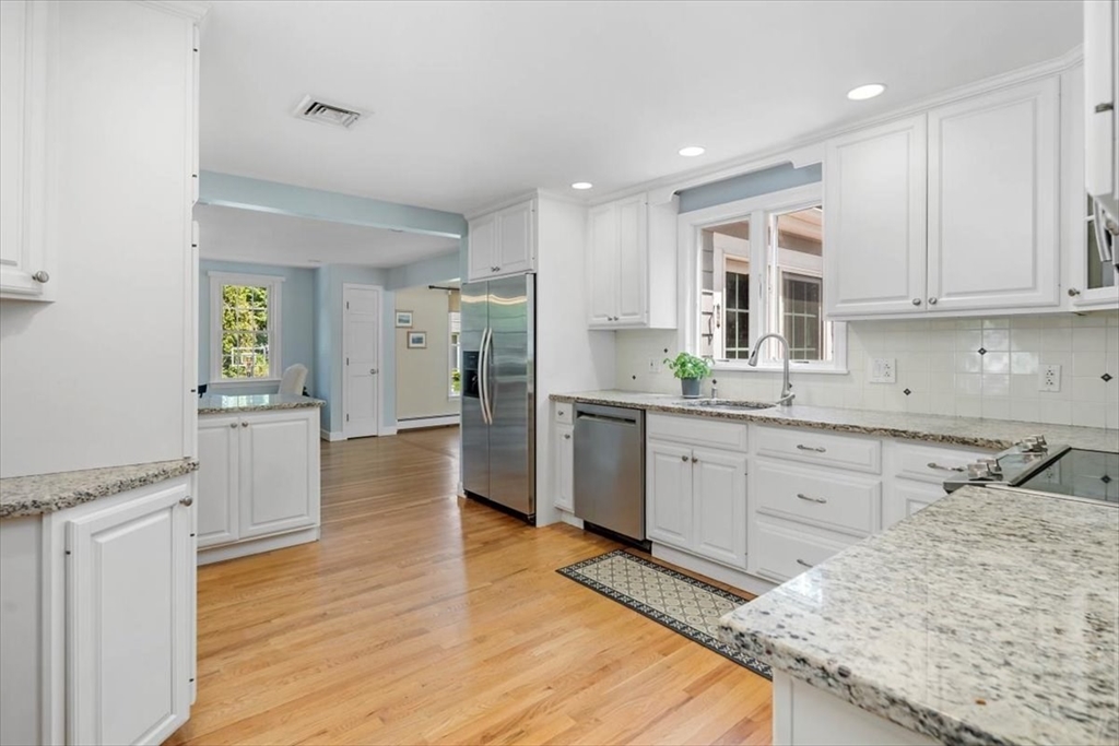 60 Old County Road Hingham, MA 02043 - Photo 12 of 32 a kitchen with a sink stove cabinets and refrigerator