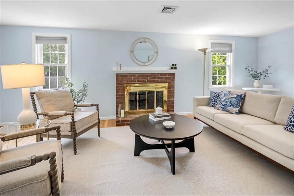 60 Old County Road Hingham, MA 02043 - Photo 13 of 32 a living room with furniture a fireplace and a large window