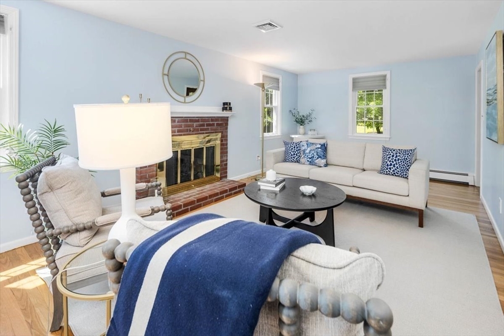 60 Old County Road Hingham, MA 02043 - Photo 16 of 32 a living room with furniture and a fireplace