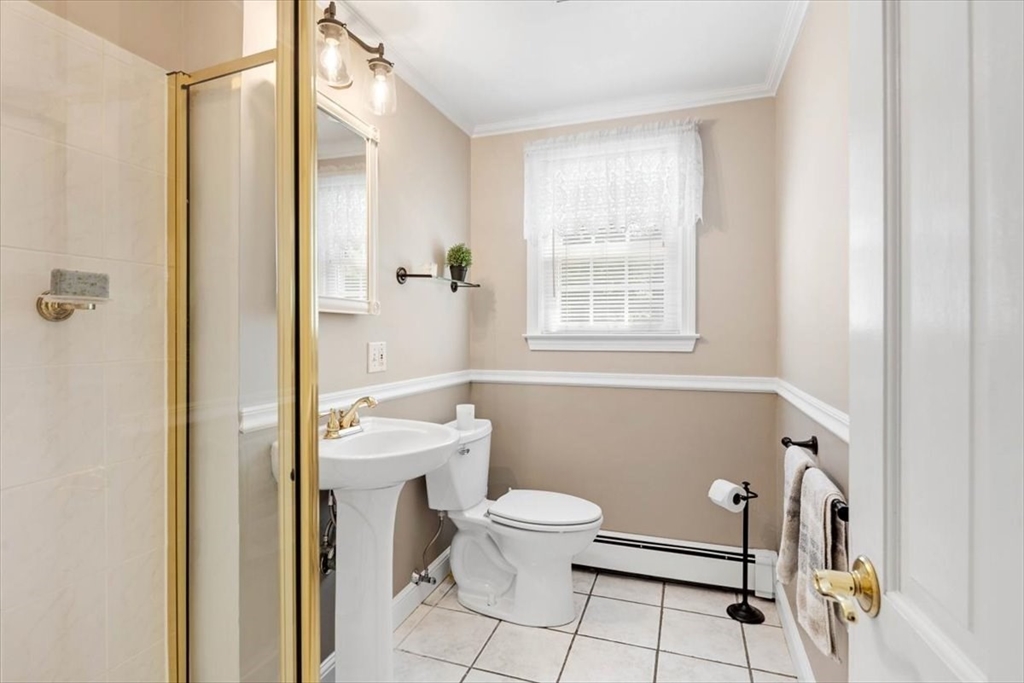 60 Old County Road Hingham, MA 02043 - Photo 18 of 32 a bathroom with a toilet a sink and a shower