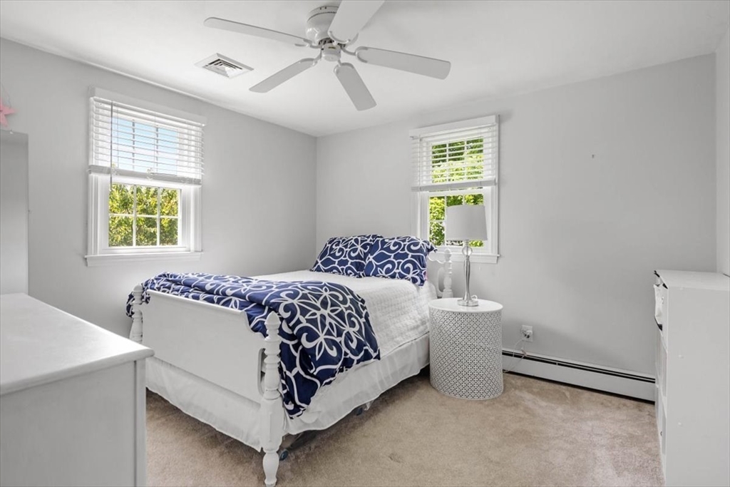 60 Old County Road Hingham, MA 02043 - Photo 19 of 32 a bedroom with a bed and a table