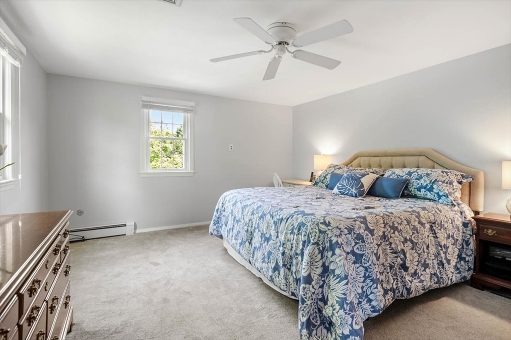 60 Old County Road Hingham, MA 02043 - Photo 22 of 32 a bedroom with a bed dresser and a window