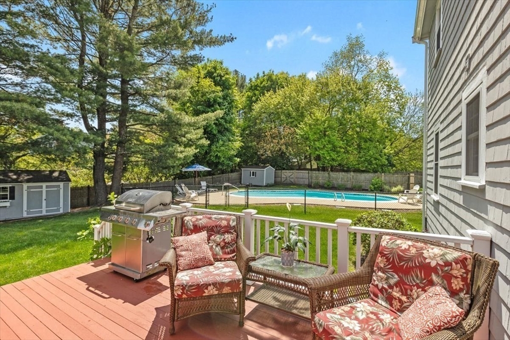 60 Old County Road Hingham, MA 02043 - Photo 24 of 32 a view of a chairs and table on the wooden deck